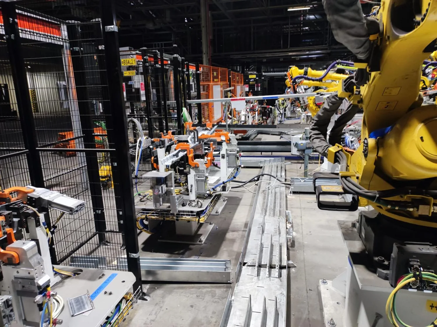 Industrial robotics workstation with robots and production line components
